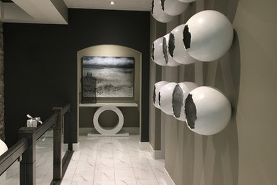 Mid-sized trendy porcelain tile and white floor hallway photo in Calgary with gray walls
