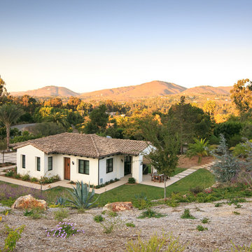 Panoramic mountain view with stucco home