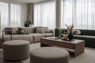 This is an example of a large scandinavian living room in London with white walls, light hardwood flooring, no fireplace and beige floors.
