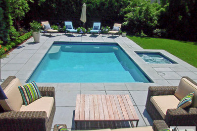 Inspiration for a small contemporary backyard rectangular pool in Boston with concrete pavers and a hot tub.