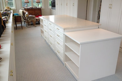 Walk-in closet - large traditional gender-neutral carpeted and gray floor walk-in closet idea in Philadelphia with raised-panel cabinets and white cabinets