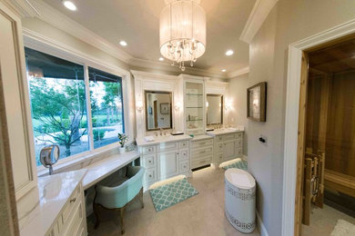 Design ideas for a large transitional master bathroom in Other with white cabinets, a one-piece toilet, marble benchtops, raised-panel cabinets, an undermount sink, a double shower, a hinged shower door, grey walls, beige tile and white benchtops.