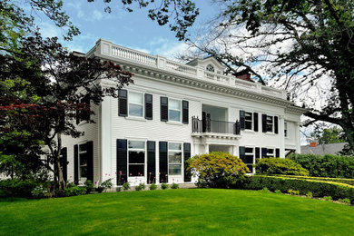 Huge traditional white three-story wood and clapboard exterior home idea in Portland