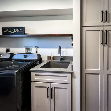Laundry Room with Custom Cabinetry Quartz Countertop and Custom Floating Shelf