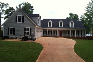 Inspiration for a mid-sized timeless gray two-story concrete fiberboard exterior home remodel in Other
