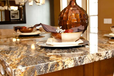 Kitchen - mid-sized traditional ceramic tile and beige floor kitchen idea in Salt Lake City with raised-panel cabinets, medium tone wood cabinets, granite countertops, beige backsplash, ceramic backsplash, stainless steel appliances, two islands and multicolored countertops