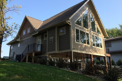 Inspiration for a large craftsman beige two-story mixed siding exterior home remodel in Minneapolis with a shingle roof