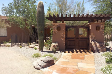 Inspiration for a mid-sized rustic home design remodel in Phoenix