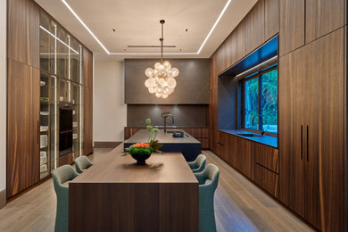Inspiration for an expansive modern u-shaped enclosed kitchen in Miami with a submerged sink, flat-panel cabinets, brown cabinets, brown splashback, dark hardwood flooring, an island, brown floors and brown worktops.