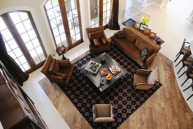 Inspiration for a large timeless open concept light wood floor family room remodel in Miami with no fireplace and no tv