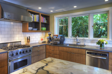 This is an example of a midcentury kitchen in Seattle with a single-bowl sink, flat-panel cabinets, dark wood cabinets, marble benchtops, white splashback, ceramic splashback, stainless steel appliances and dark hardwood floors.