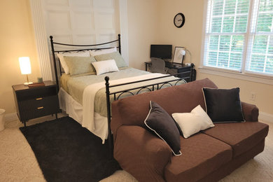 Small trendy guest carpeted and beige floor bedroom photo in Raleigh with beige walls