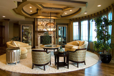 Basement - large transitional look-out medium tone wood floor basement idea in Chicago with beige walls, a standard fireplace and a tile fireplace