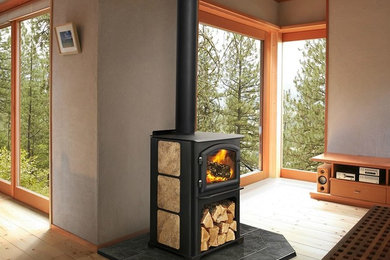 Mid-sized trendy formal and enclosed light wood floor and beige floor living room photo in Bridgeport with gray walls, a wood stove, a metal fireplace and no tv