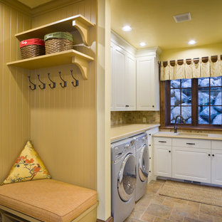Photo of a classic u-shaped utility room in Portland with a side by side washer and dryer and beige worktops.