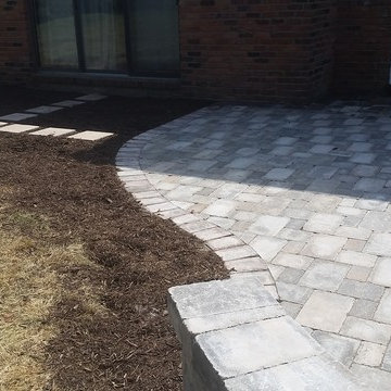 Unilock Brussels Patio w/ an Oaks Colonnade Border & Unilock Seat Wall & Firepit