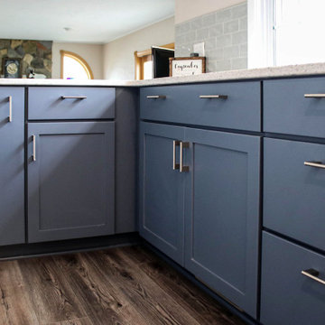 Two-Tone White & Blue Kitchen with Smoke Stained Quartz Countertops