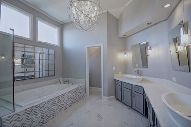 Large transitional master gray tile, white tile and ceramic tile marble floor bathroom photo in Atlanta with shaker cabinets, gray cabinets, gray walls, a vessel sink and granite countertops