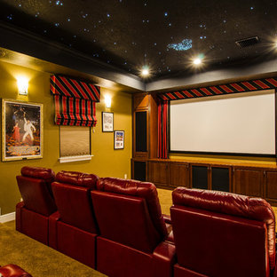 Inspiration for a large timeless enclosed carpeted and brown floor home theater remodel in Tampa with a projector screen and brown walls
