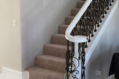 White Staircase with Iron Balusters