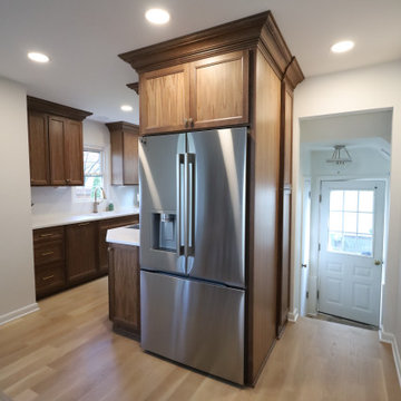 Rich & Refined: Custom Walnut Kitchen Remodel with White Quartz & Oak Flooring