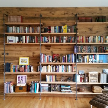 Reclaimed wood wall and metal book shelvings