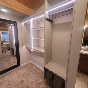 Open concept master closet with lighting