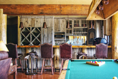 Example of a mountain style home bar design in Other