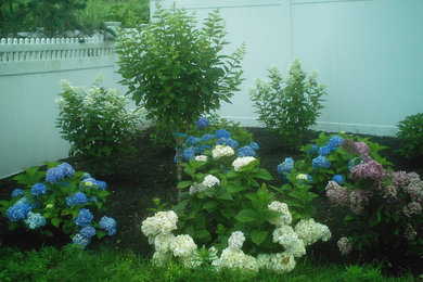 Inspiration for a medium sized nautical back partial sun garden for summer in Other.