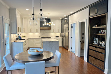 Example of a mid-sized trendy galley eat-in kitchen design in Atlanta with an undermount sink, shaker cabinets, white cabinets, marble countertops, multicolored backsplash, marble backsplash, an island and multicolored countertops