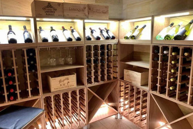 Design ideas for a mid-sized modern wine cellar in Sydney.