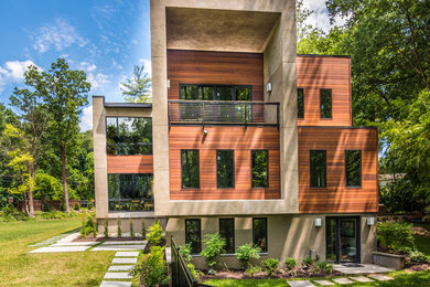 Inspiration for a huge contemporary beige three-story mixed siding flat roof remodel in DC Metro