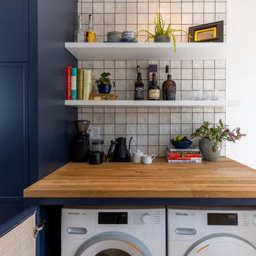 Hidden Side-by-Side Laundry System in Kitchen