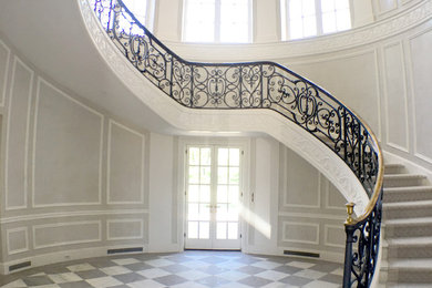 Example of a large classic foyer design in Dallas with gray walls