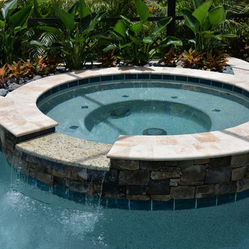 Pool and spa with Rock Water Features in Davenport, Florida