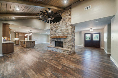 Inspiration for a large craftsman dark wood floor and brown floor dining room remodel in Houston