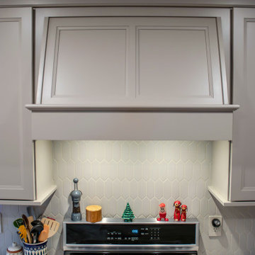 Two-Tone Neutral Kitchen with Quartz Countertop and Soho Picket Backsplash