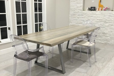 Inspiration for a large industrial light wood floor and white floor enclosed dining room remodel in San Francisco with gray walls and no fireplace