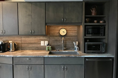 Inspiration for a small transitional galley eat-in kitchen remodel in Other with an undermount sink, flat-panel cabinets, dark wood cabinets, granite countertops, gray backsplash, ceramic backsplash, stainless steel appliances, no island and brown countertops