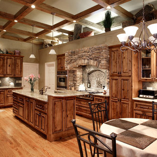 Large rustic kitchen pantry remodeling - Large mountain style kitchen pantry photo in St Louis with an island