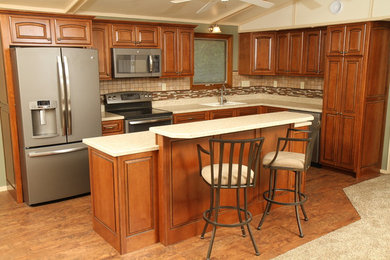 Eat-in kitchen - mid-sized modern l-shaped eat-in kitchen idea in Other with a drop-in sink, medium tone wood cabinets, stainless steel appliances and an island