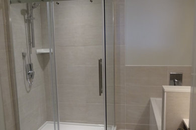 Mid-sized transitional beige tile and porcelain tile porcelain tile bathroom photo in Toronto with dark wood cabinets, white walls, an undermount sink and quartz countertops