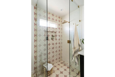 Example of a minimalist cement tile cement tile floor and single-sink bathroom design in Los Angeles with white countertops