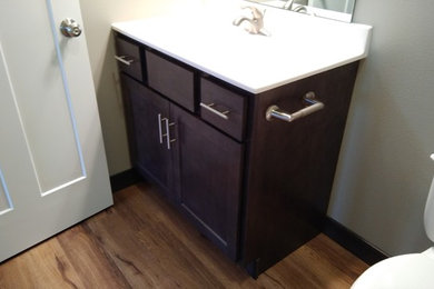 Small transitional kids' vinyl floor and brown floor bathroom photo in Cedar Rapids with shaker cabinets, gray cabinets and an integrated sink