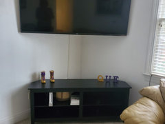 Space between wall mounted 2024 tv and console