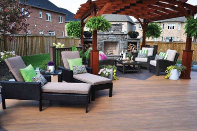 Design ideas for a large contemporary backyard deck in Boston with a fire feature and a pergola.
