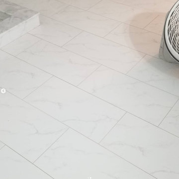 Bright White Walk In Shower Remodel With Herringbone Accent Tile