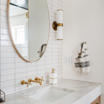 Handmade White Tile Backsplash with Golden Fixtures