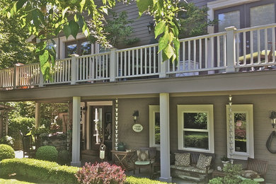 This is an example of a large eclectic two-storey grey exterior in Portland with wood siding.