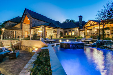 Hot tub - mid-sized mediterranean backyard rectangular natural hot tub idea in Dallas with decking